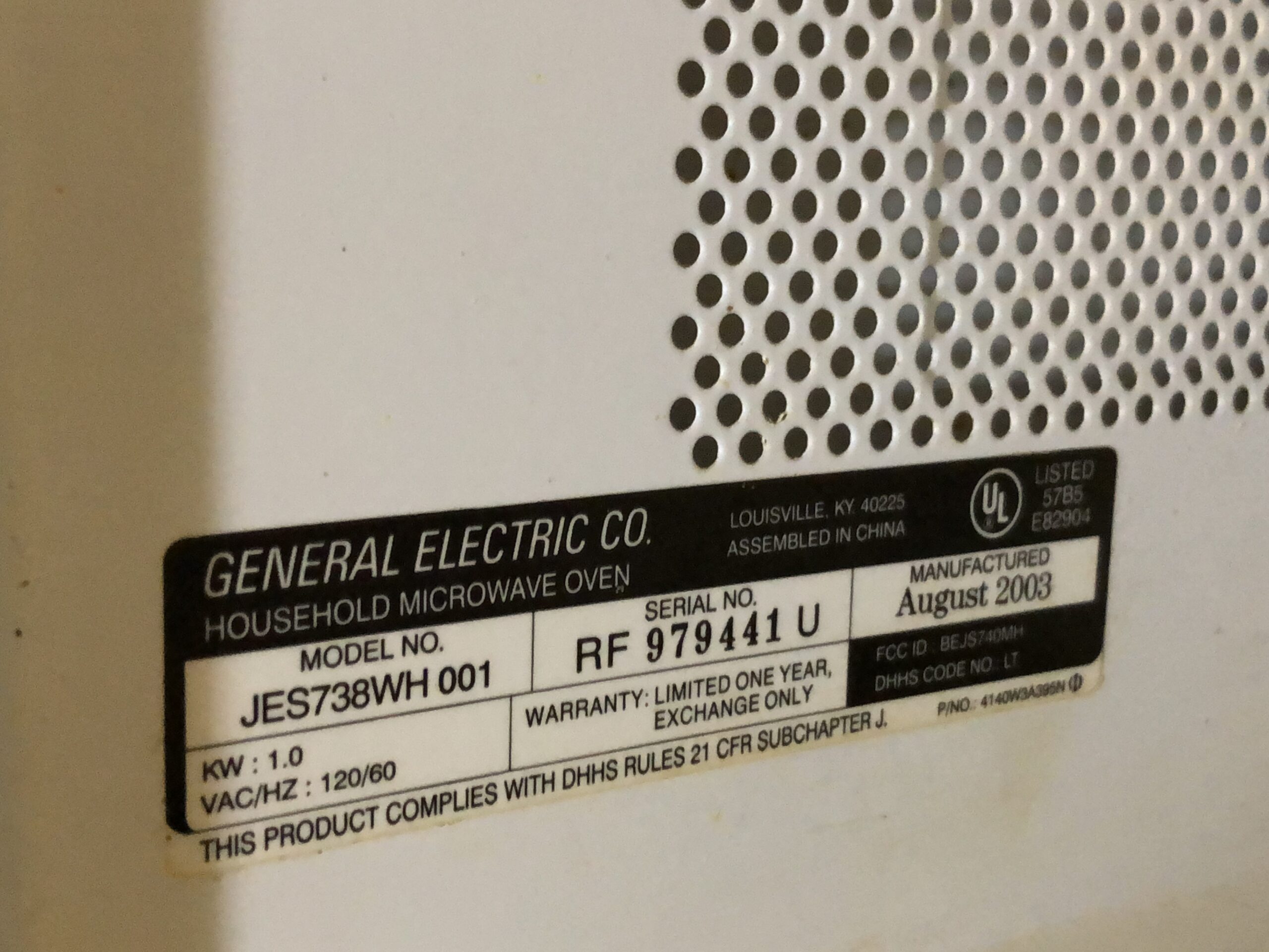 美國 GE 微波爐機身型號銘牌，標有 1.0 kW